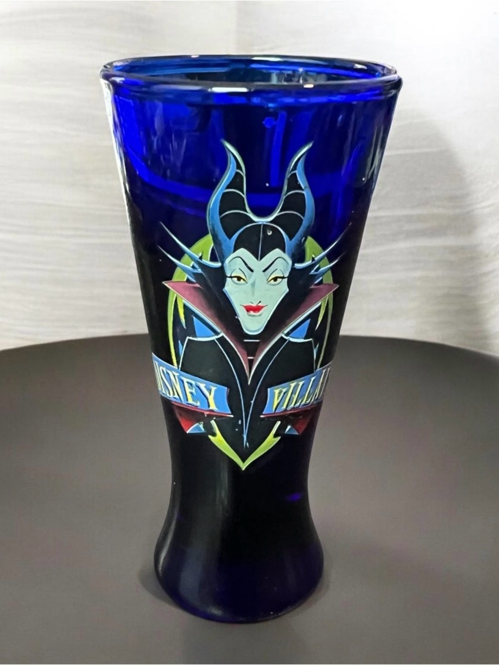 tapered 4-inch Disney Villains shot glass, Maleficent on cobalt blue glass.